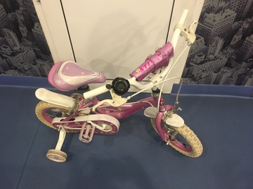 Selling: Pink cycle with training wheels 